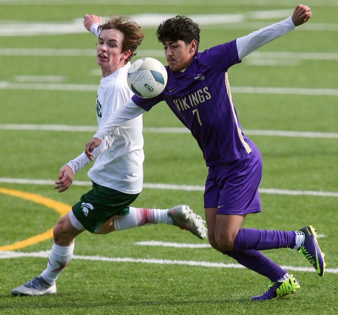 North Kitsap’s Aaron Lopez (7) and Skyline’s Samuel Avaramov battle for control of the ball on Saturday, March 9, 2024.
