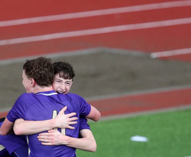 North Kitsap’s Harper Sabari embraces Ethan Peck (11) as they celebrate Sabari’s goal that put them 2-1 ahead of Skyline on Saturday, March 9, 2024.