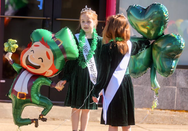 West Sound Pearl Princess Violet Haney, 9, holds hands with her leprechaun balloon prior to the start of Bremerton’s 30th. annual St. Patrick's Day Parade in downtown on Saturday, March 16, 2024.