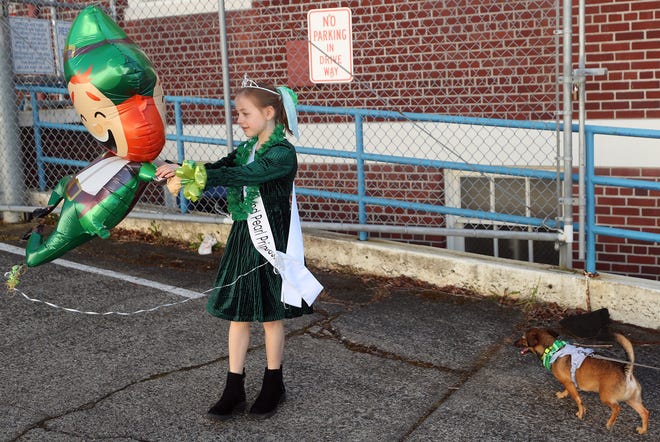 West Sound Pearl Princess Violet Haney, 9, dances with her leprechaun balloon prior to the start of Bremerton’s 30th. annual St. Patrick's Day Parade through downtown on Saturday, March 16, 2024.