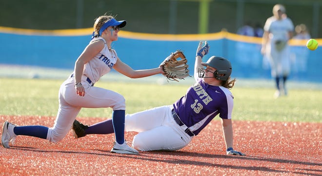 North Kitsap’s Hannah Richards slides and beats the throw to Olympic’s Hailey Feltis at second during their game at Lobe Fields on Tuesday, March 19, 2024.
