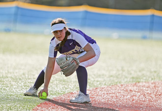 North Kitsap’s Cerenity Fake (33) grabs a ground ball against Olympic at Lobe Fields on Tuesday, March 19, 2024.
