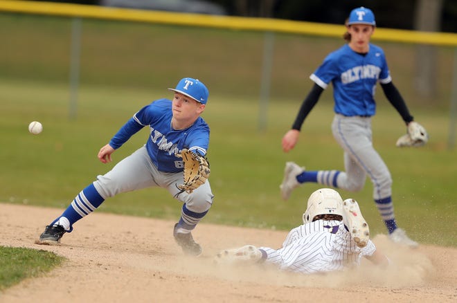 North Kitsap’s Alex Elton (7) beats the throw to Olympic’s Blake Parker (6) and steals second during their game in Poulsbo on Wednesday, March 20, 2024. North Kitsap won the game 5-1.