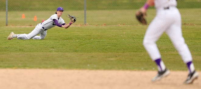 North Kitsap’s Jonathan Bourque (10) lays out for a catch during their 5-1 win over Olympic in Poulsbo on Wednesday, March 20, 2024.