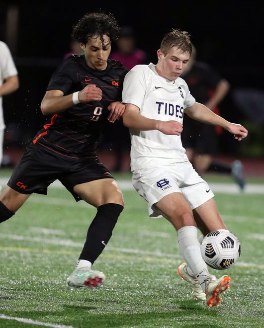 Gig Harbor’s Ethan Schuette (5) takes control of the ball while under the pressure of Central Kitsap’s Alejandro Garcia (9) in Silverdale on Thursday, March 21, 2024.