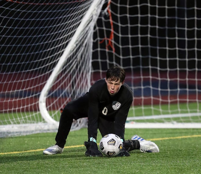 Gig Harbor goalkeeper Trey Crosby scoops up a Central Kitsap shot on goal during their game in Silverdale on Thursday, March 21, 2024.