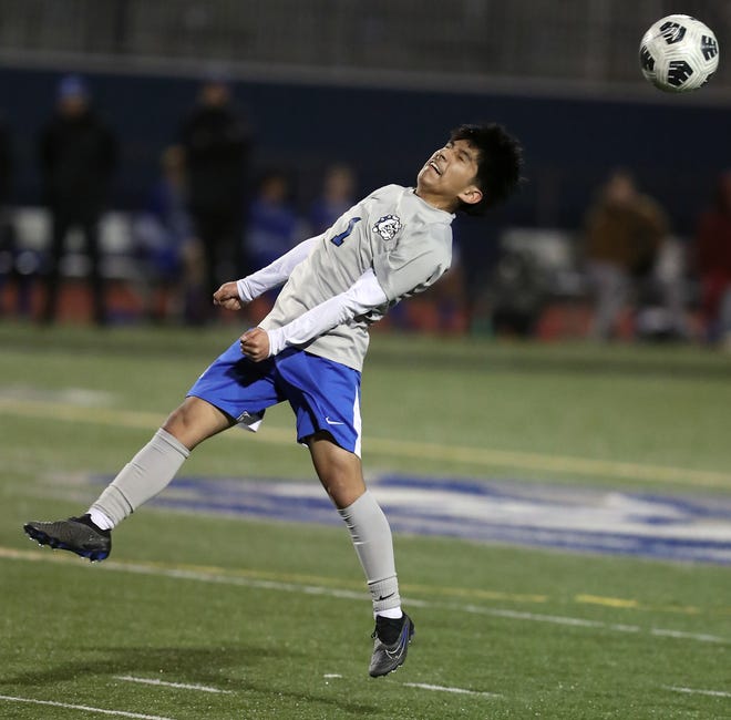 North Mason’s Christian Santiago (1) heads the ball during their 1-0 win over Olympic on Tuesday, March 26, 2024.